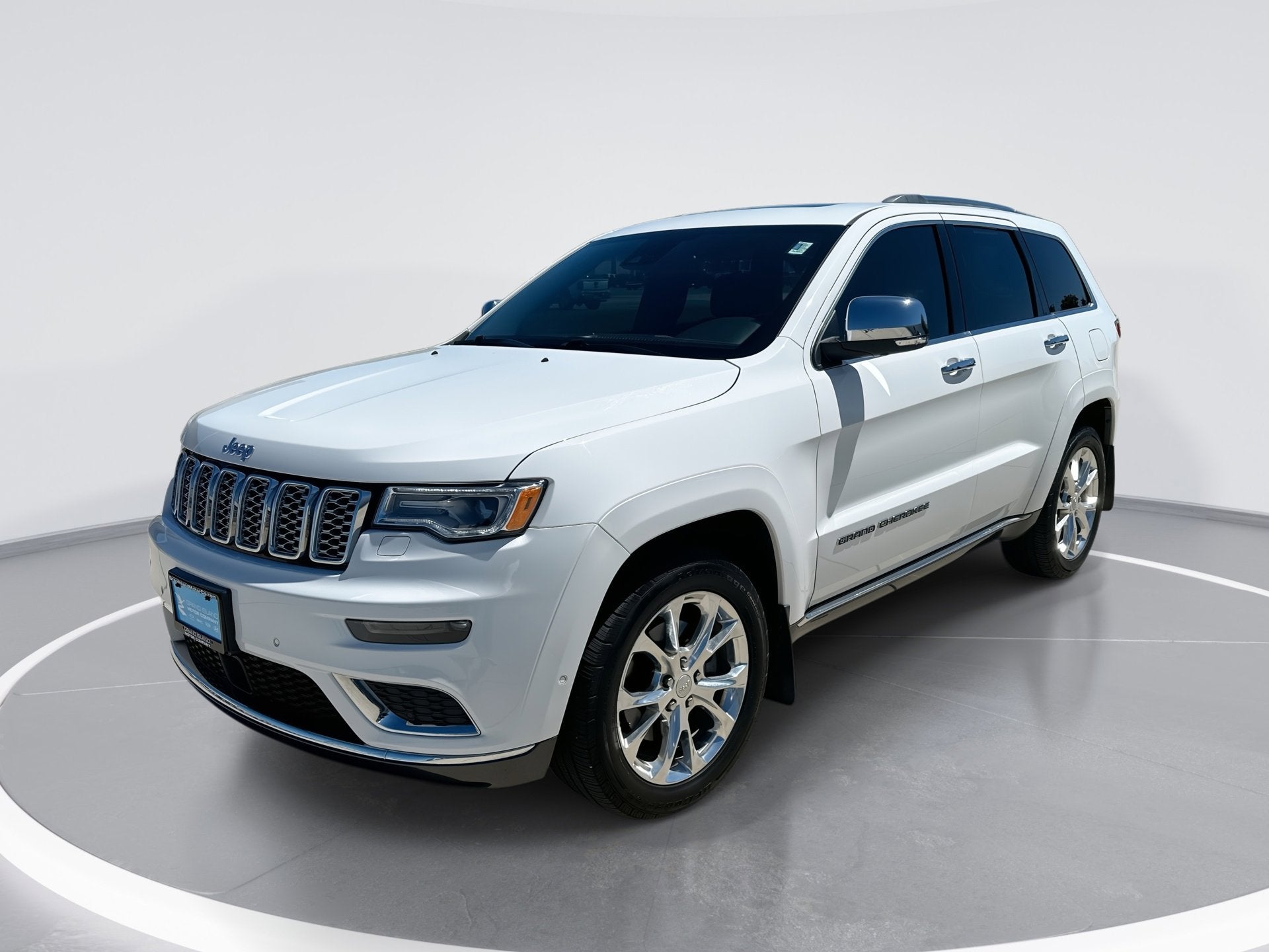 2019 Jeep Grand Cherokee Summit in Bright White Cl — front three-quarter view