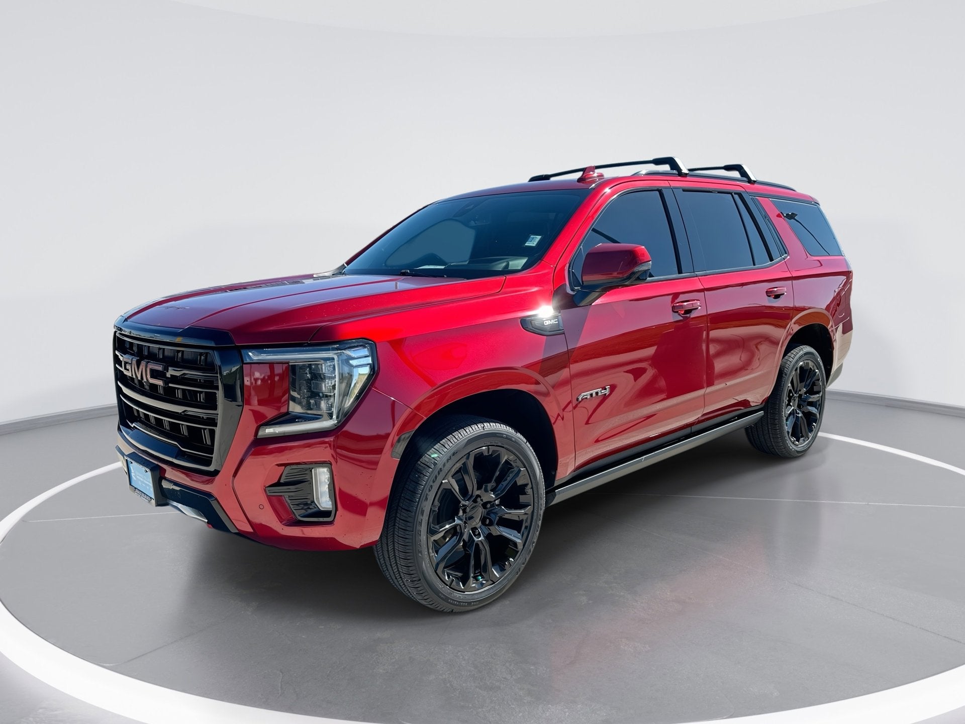 2021 GMC Yukon AT4 in Cayenne Red Tintcoat — front three-quarter view