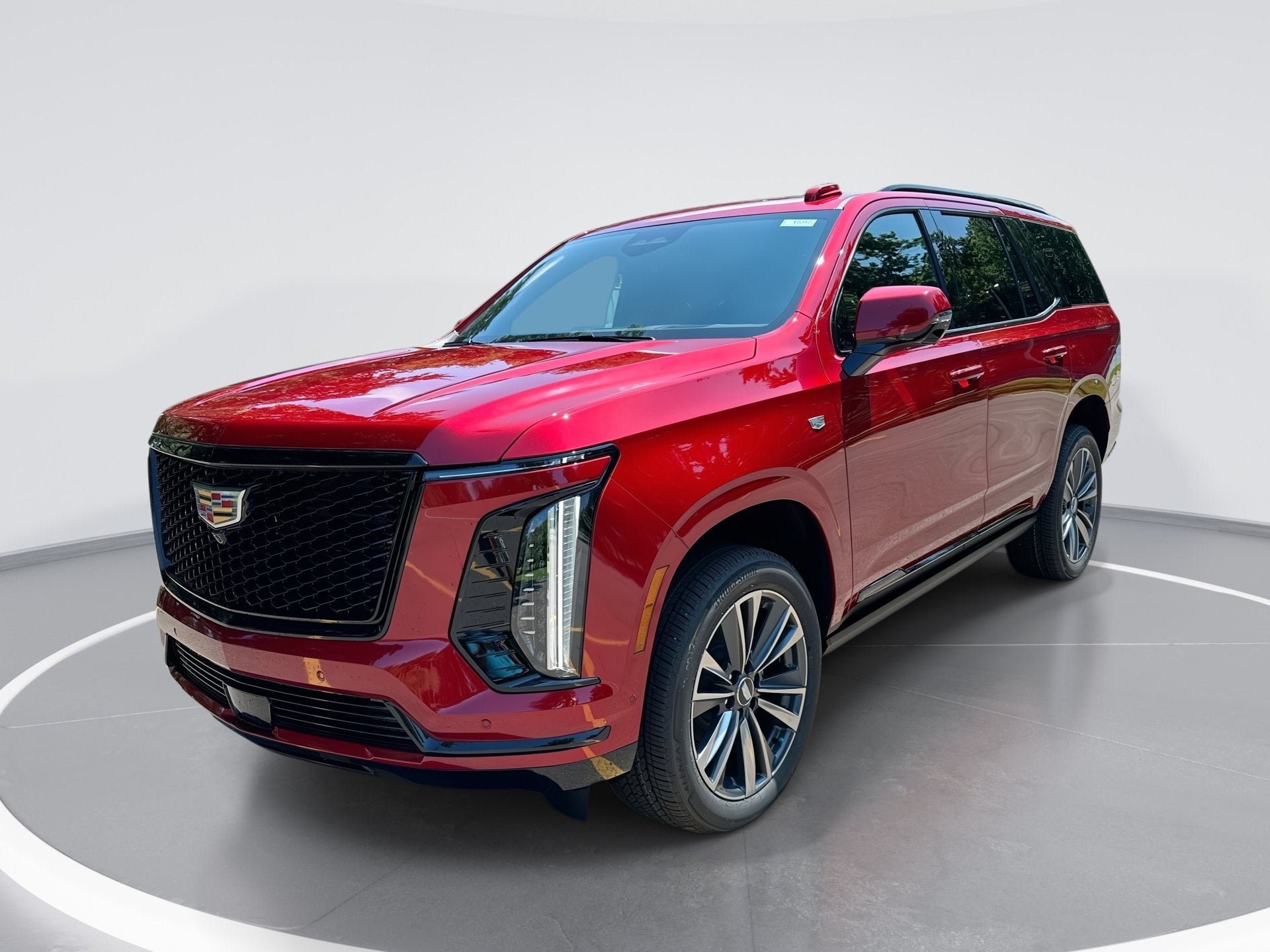 2026 Cadillac Escalade Sport in Radiant Red Tintcoat — front three-quarter view